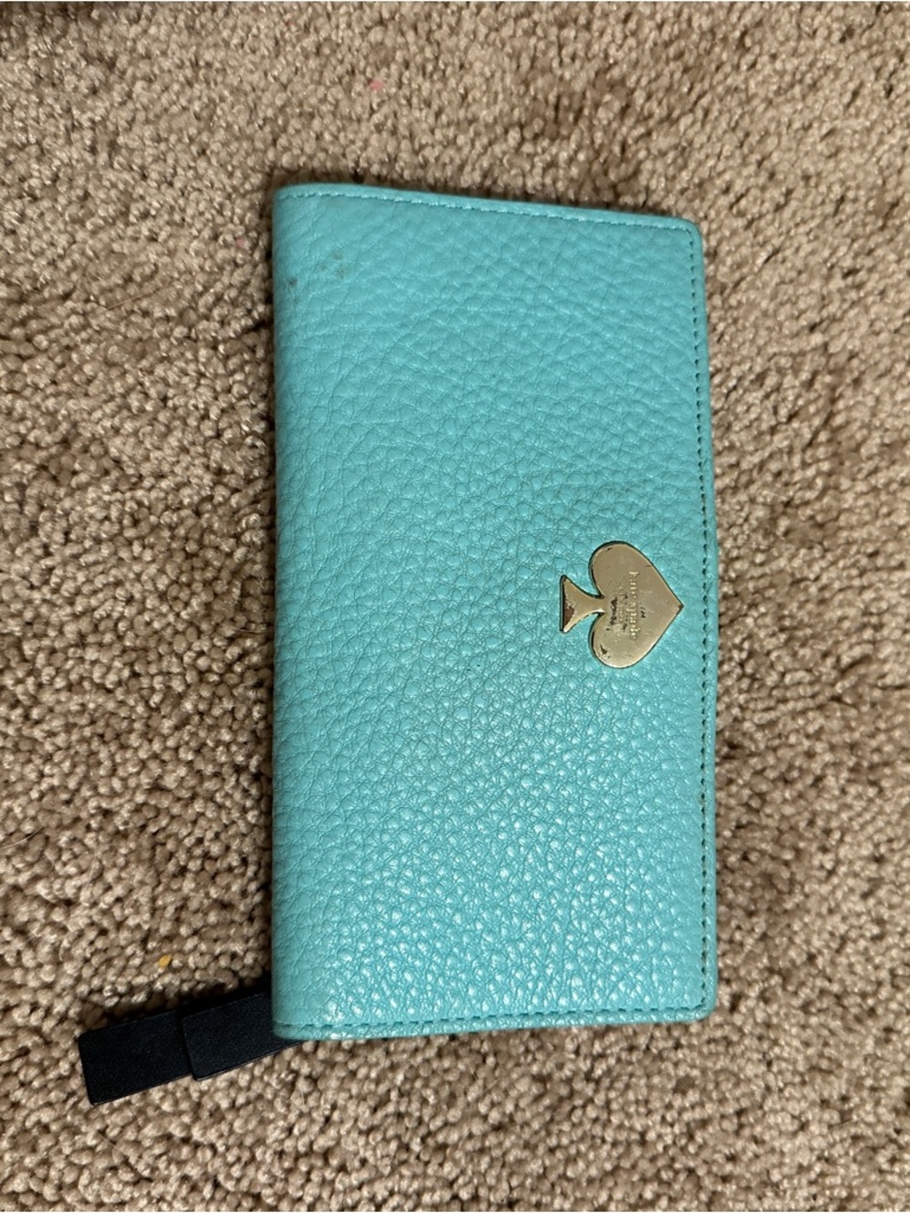 kate spade turquoise pebbled leather zip wallet with black bow zipper charm
